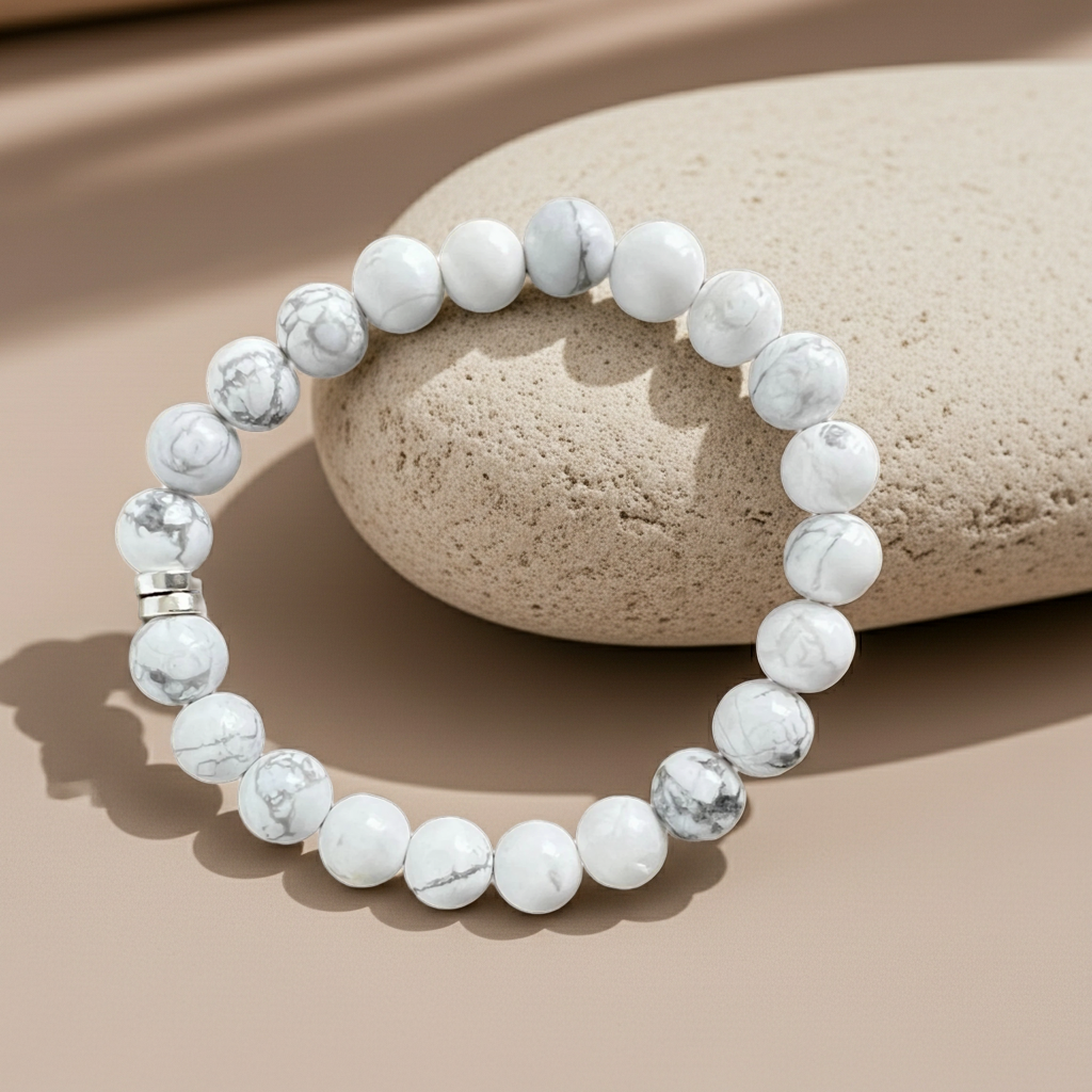 White beaded bracelet on a beige stone
